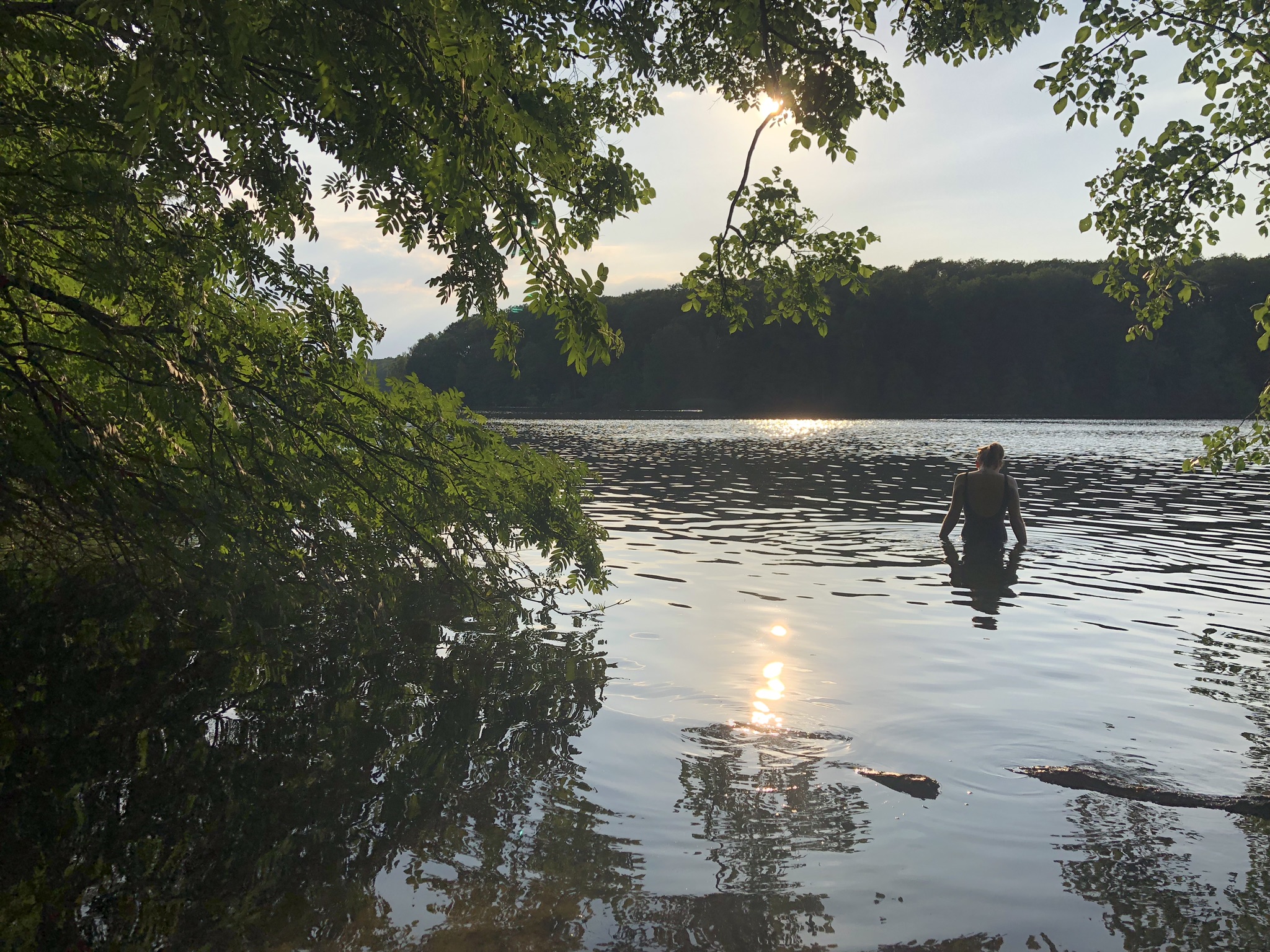 The lake Schlachtensee with Paulina wading out to swim.